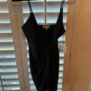 Black front tie dress from revolve. Size medium brand new with tags.